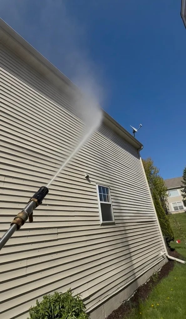Soft washing vinyl siding on a two-story South Metro MN home