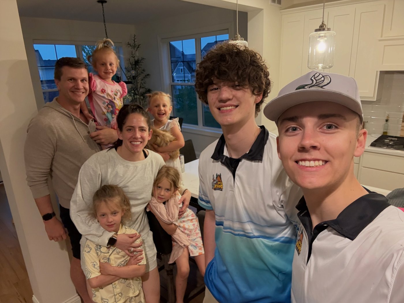 The Gray Duck Pro Wash crew with a happy client family after a window cleaning job in the South Metro MN
